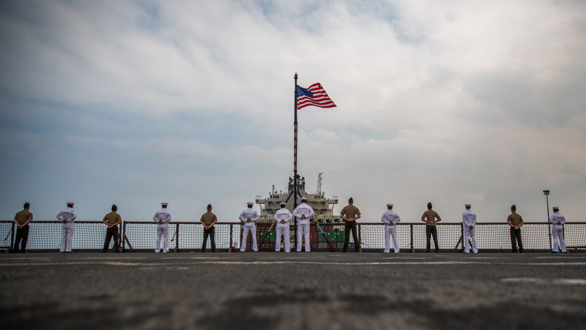 What is the significance and meaning of "Manning the Rails" as ships