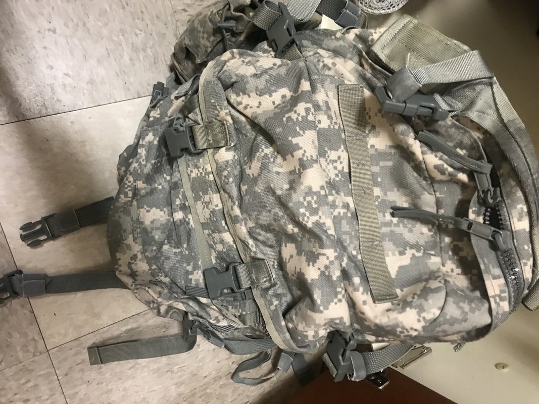 Based on the current AR 6701, are coyote brown backpacks authorized